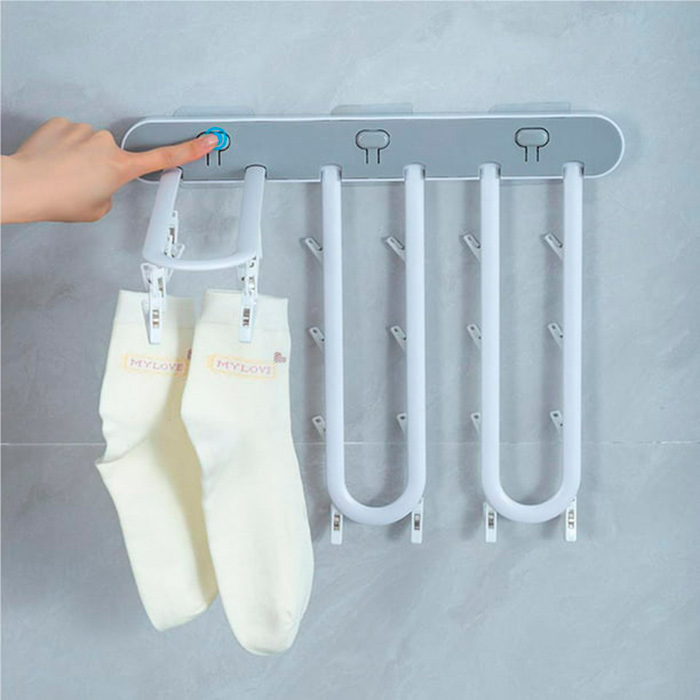 Просто поставете закачалката за дрехи на равна повърхност с помощта на самозалепващия се дизайн!
